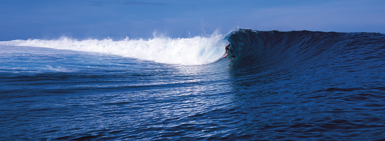 Surfer in the sea, Tahiti, French Polynesia