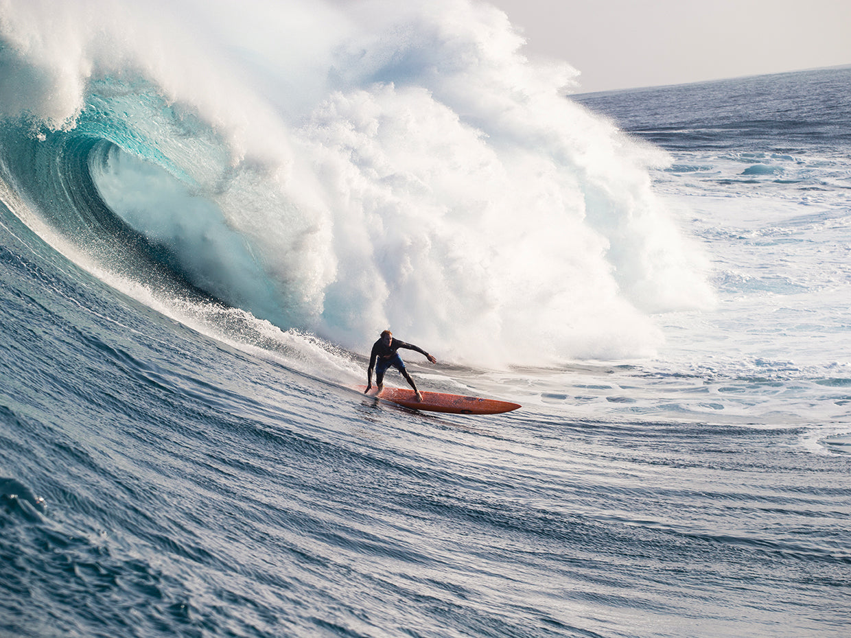 Male surfer surfing wave in Pacific Ocean, Peahi,Hawaii,USA 3