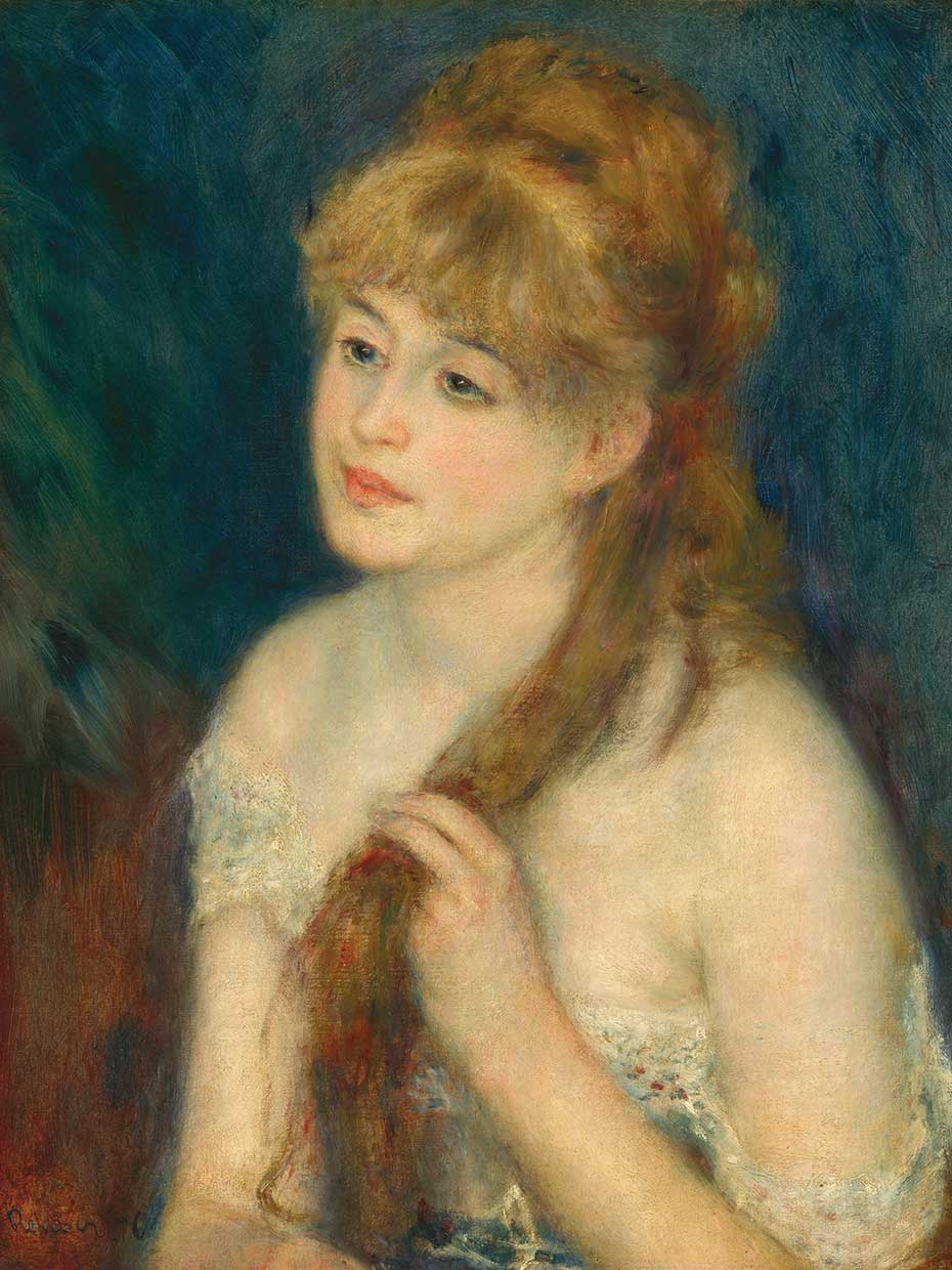 Young Woman Braiding Her Hair