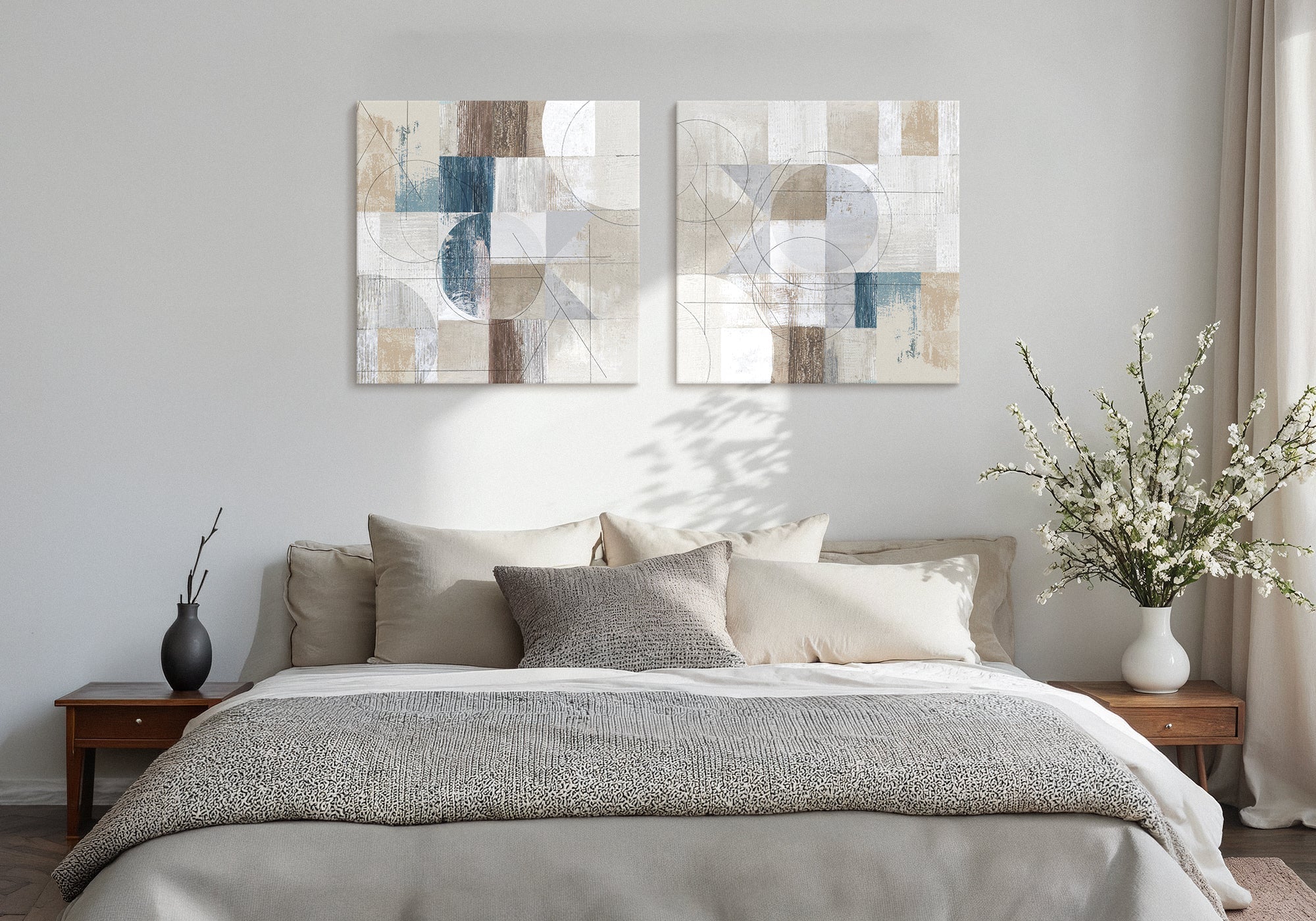 Relaxed neutral guest bedroom with warm-toned wall art above the bed