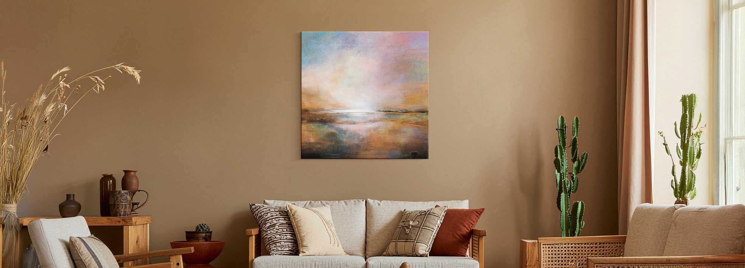 Warm, earthy living room with terracotta tones, natural texture, and wall art