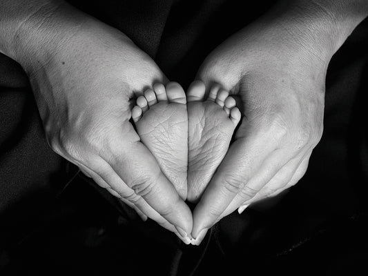 Family Love by Nora Hernandez is a heart-warming figural black and white photograph printed on canvas or framed canvas