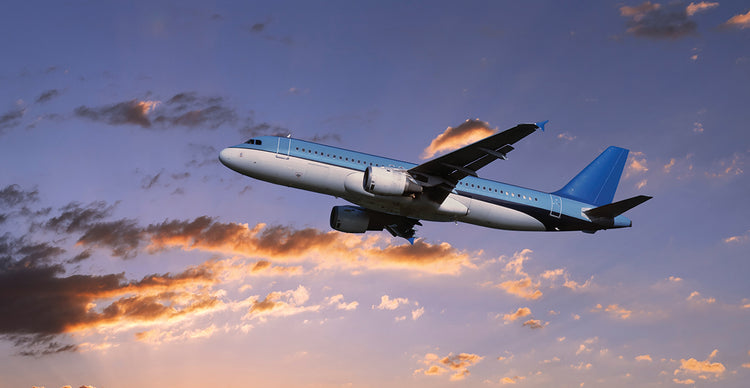 Airplane in Sunset Skies