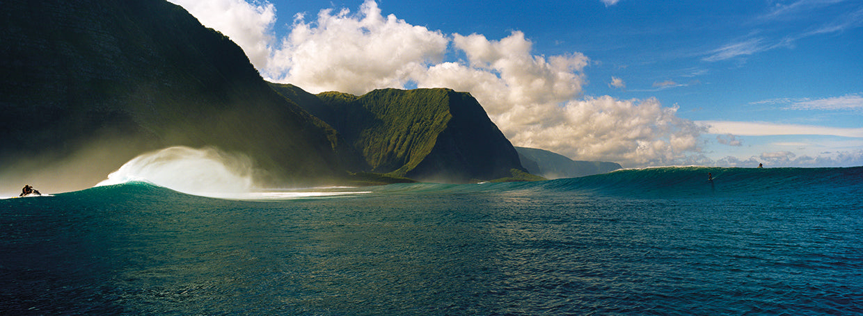 Rolling waves with mountains in the background, Molokai,Hawaii
