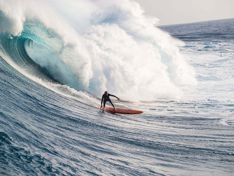 Male surfer surfing wave in Pacific Ocean, Peahi,Hawaii,USA 3