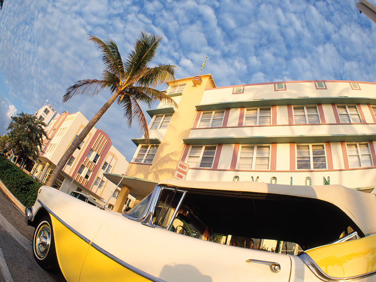 Car on the road with a building in the background, Miami Beach, Miami-Dade County, Florida, USA