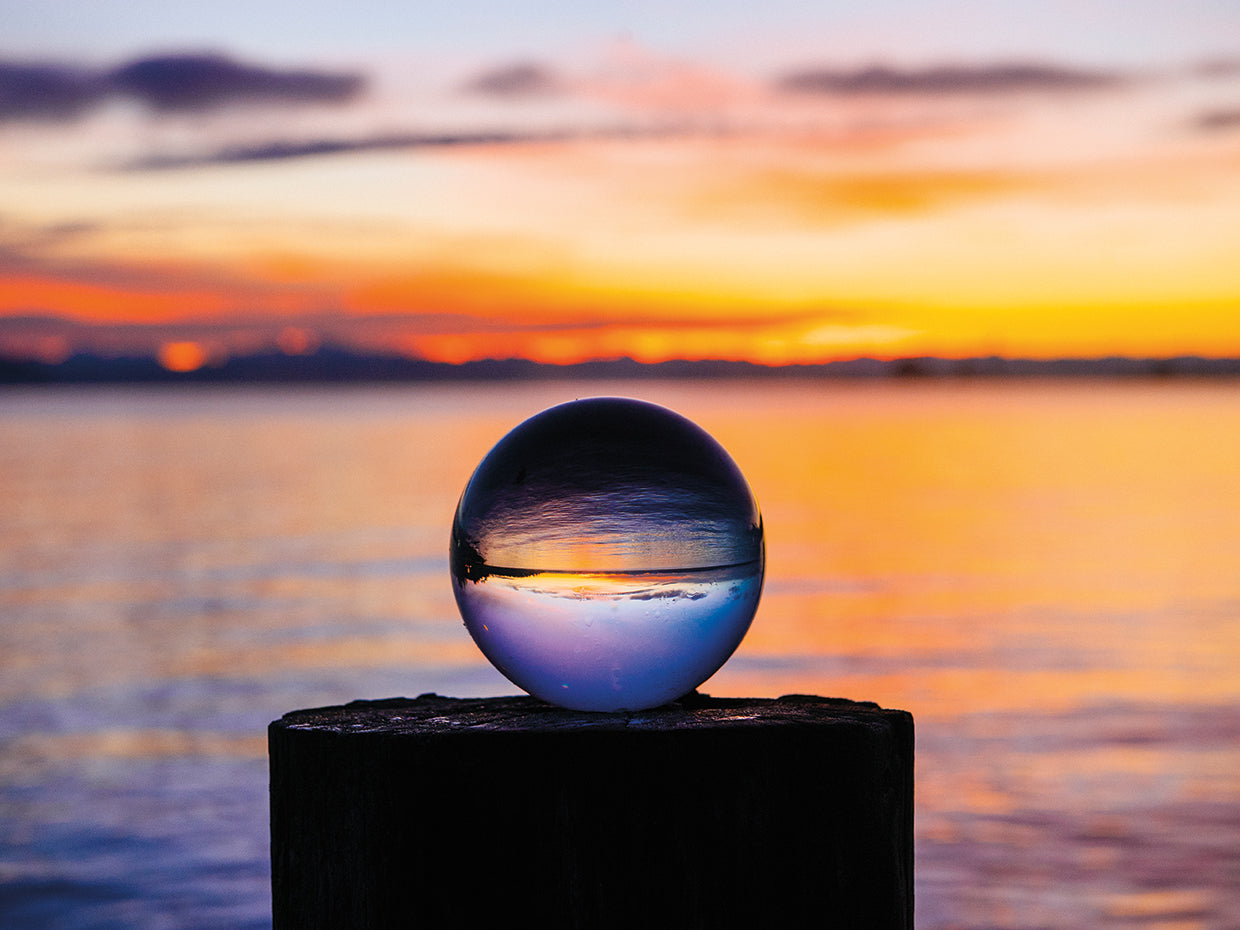Crystal ball on shore at sunset, Norwegian Point County Park, Hansville, Washington, USA